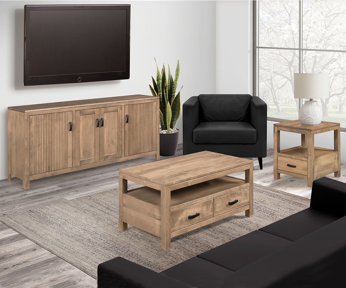 Living room with wooden furniture: TV, sideboard, coffee table, side table, black armchair, and a rug.