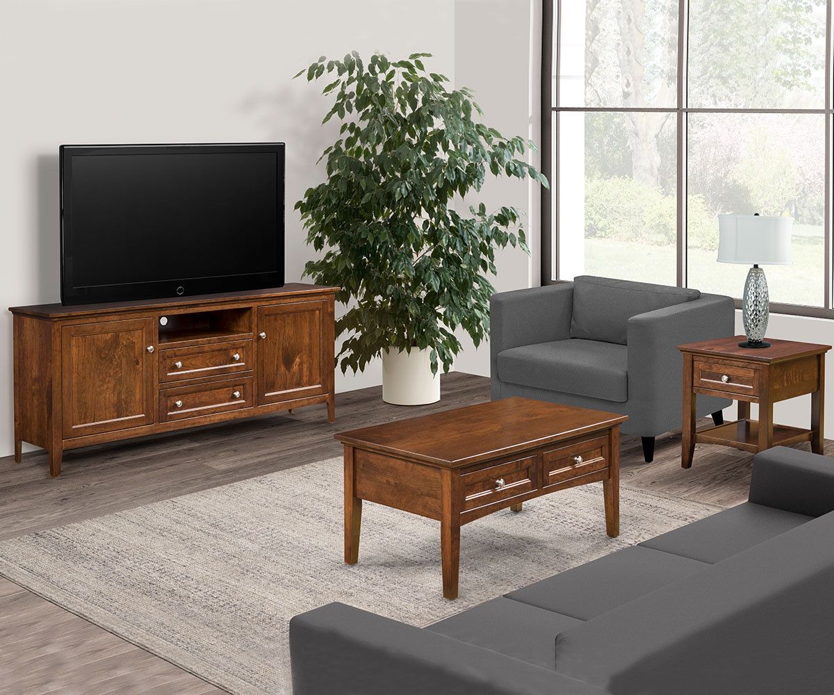 Living room with wooden furniture, gray sofa, armchair, rug, and large TV.