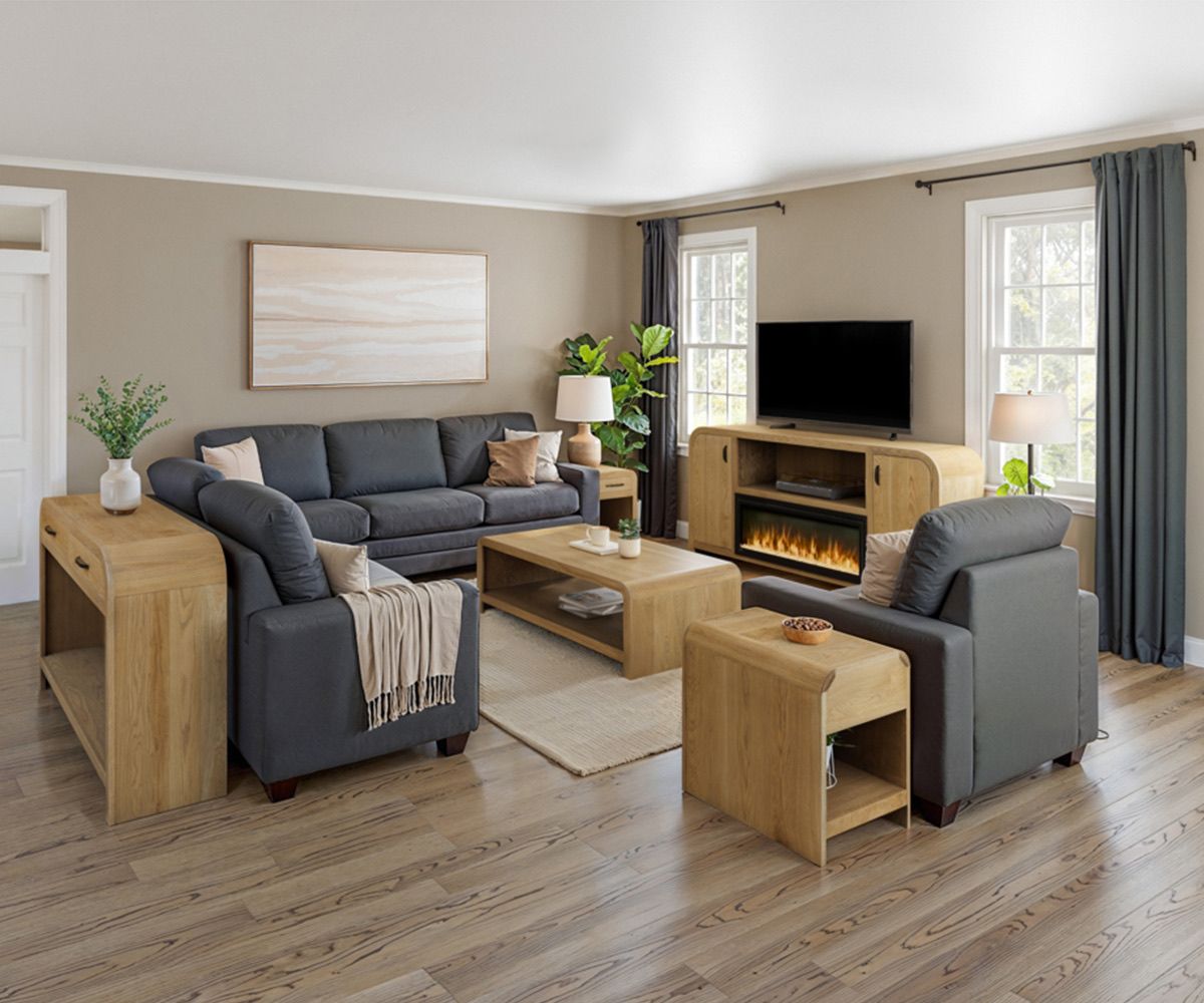 Living room with gray sofa, armchairs, and wood furniture.