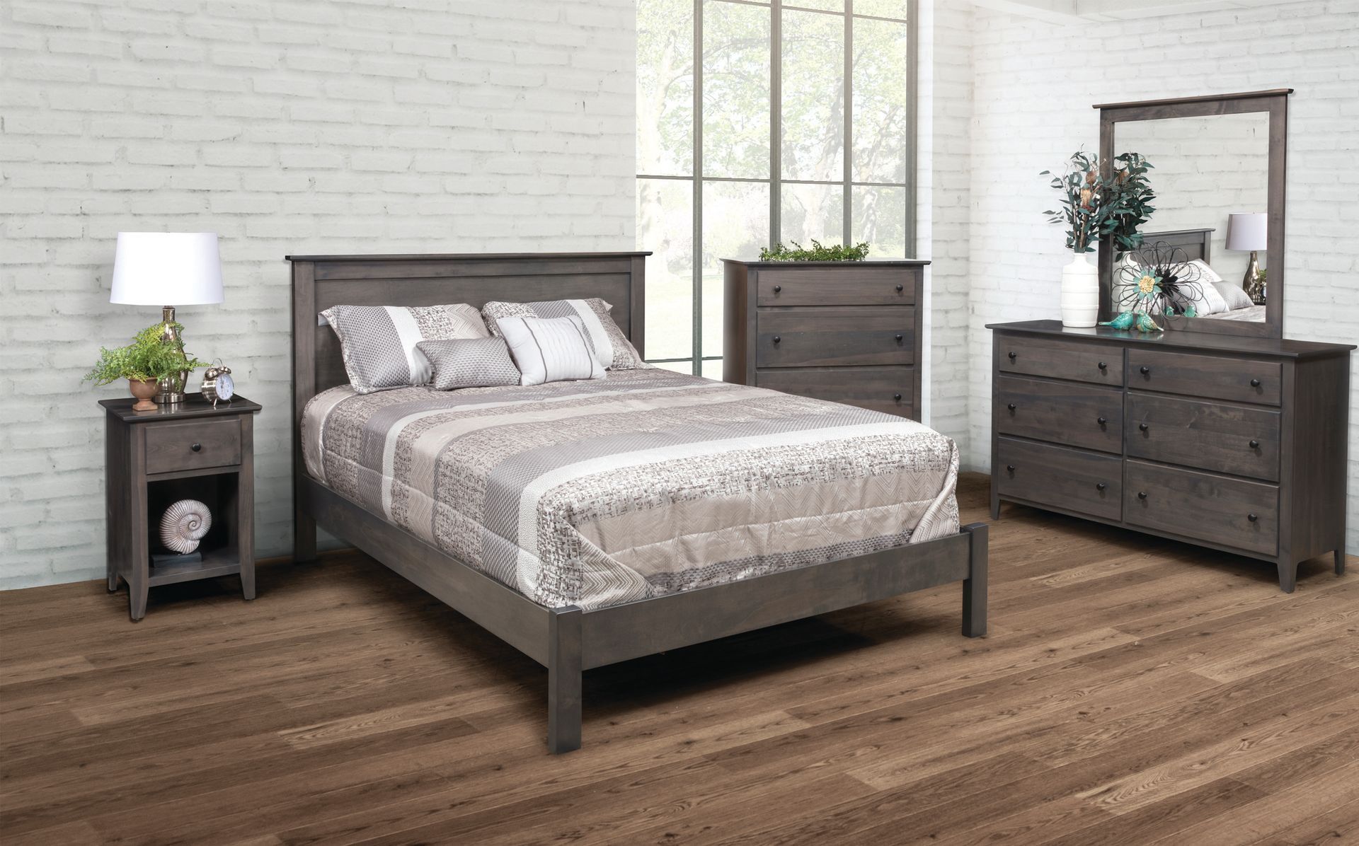 Bedroom furniture set in gray: bed, nightstand with lamp, chest of drawers, dresser with mirror.