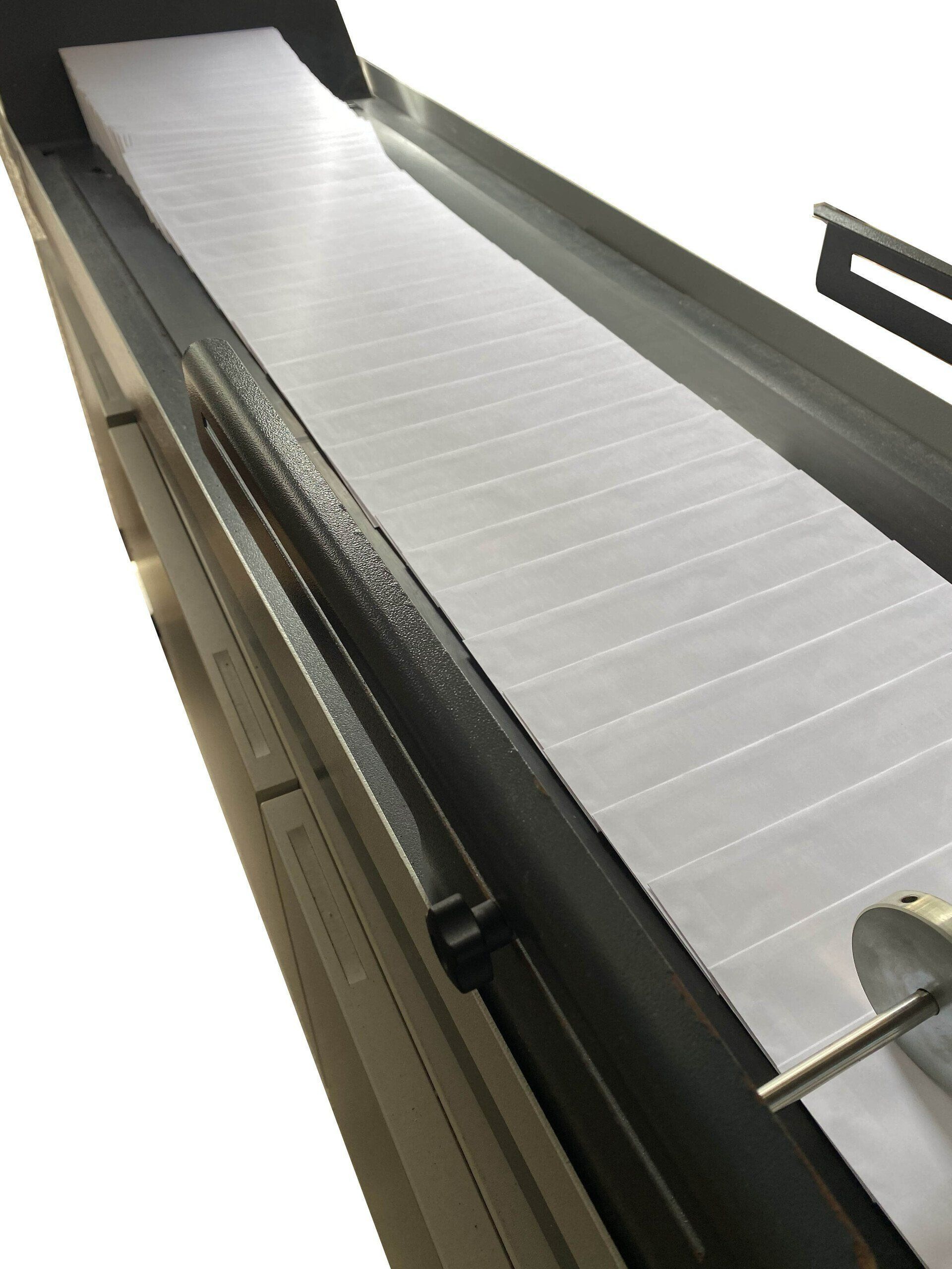 Conveyor Belt Carrying Many White, Flat Strips Inside a Metal Frame — Digi Print Pro in Bangalow, NSW