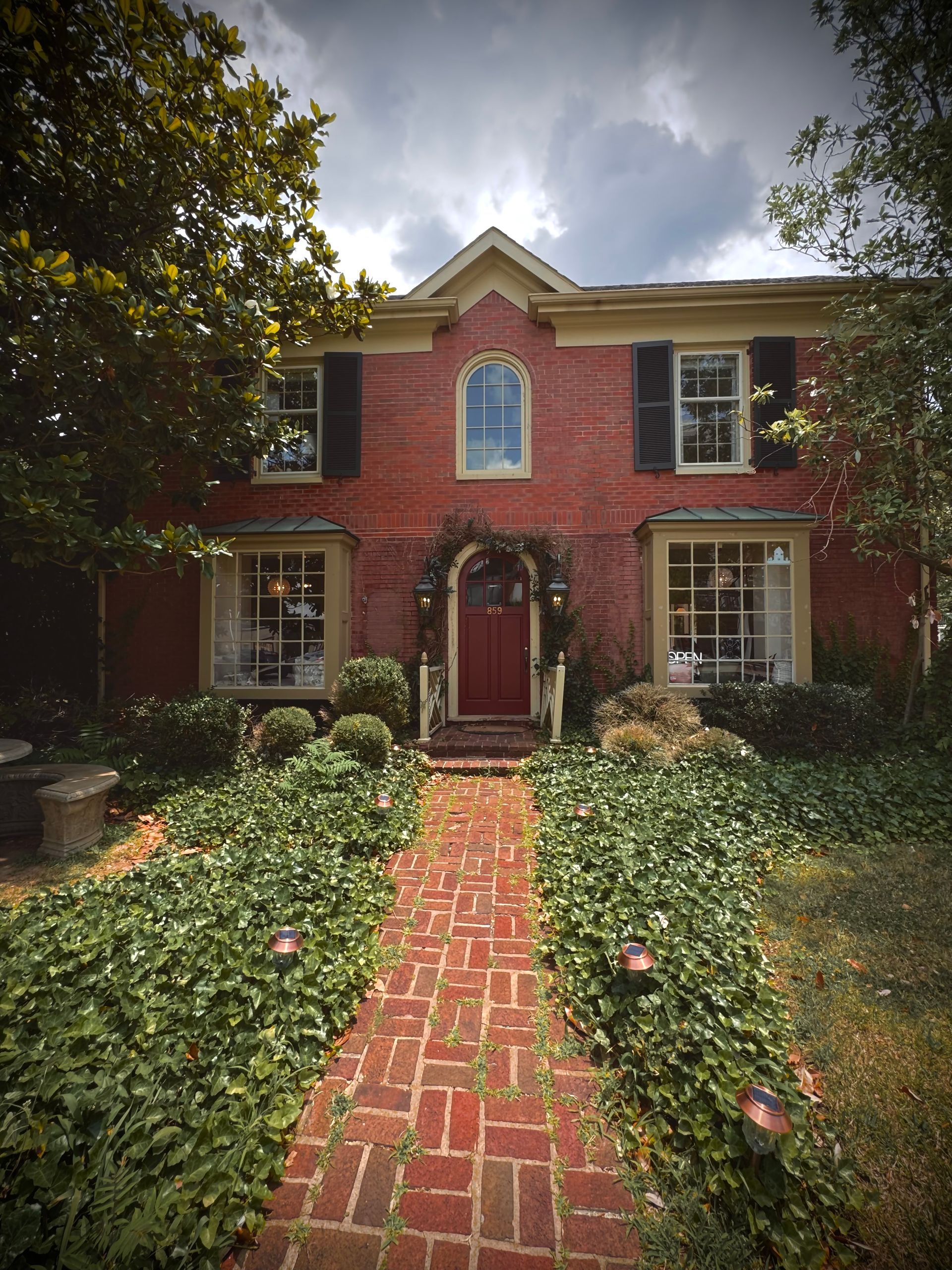 Exterior of Brevede Coworking space, a cozy brick building located in the heart of Chevy Chase. Best Coffee in Lexington KY, office space available.