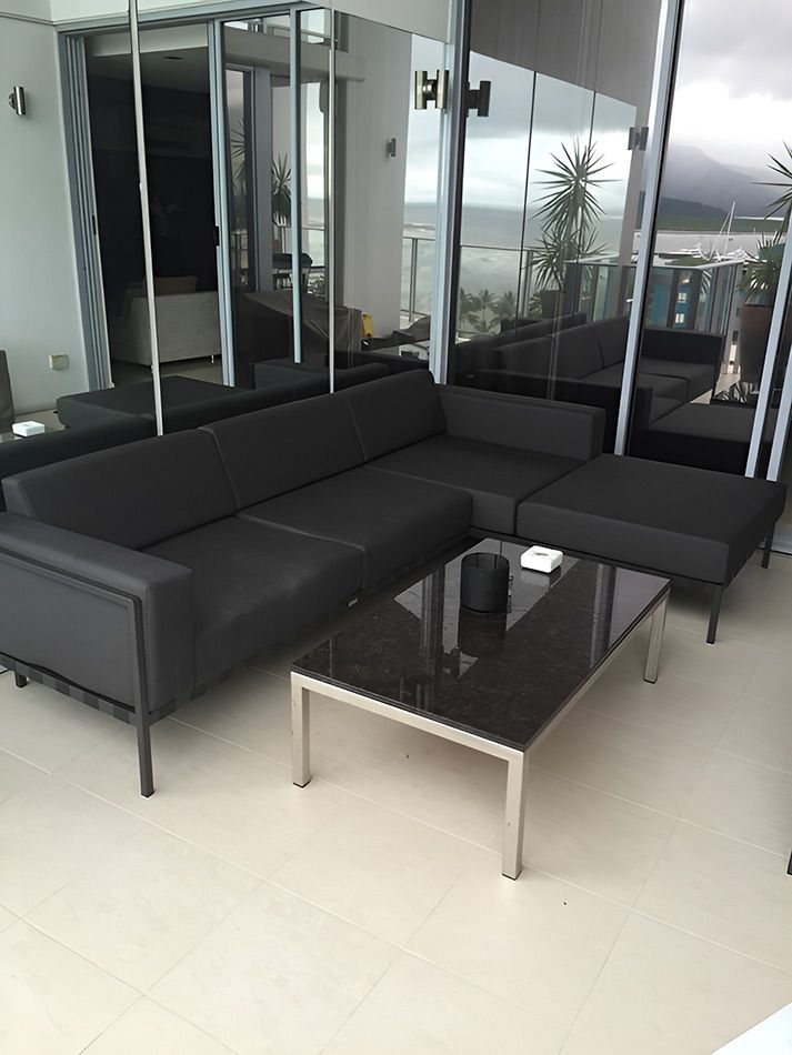 A Living Room With A Couch And A Coffee Table — Stitch Master in Manunda, QLD