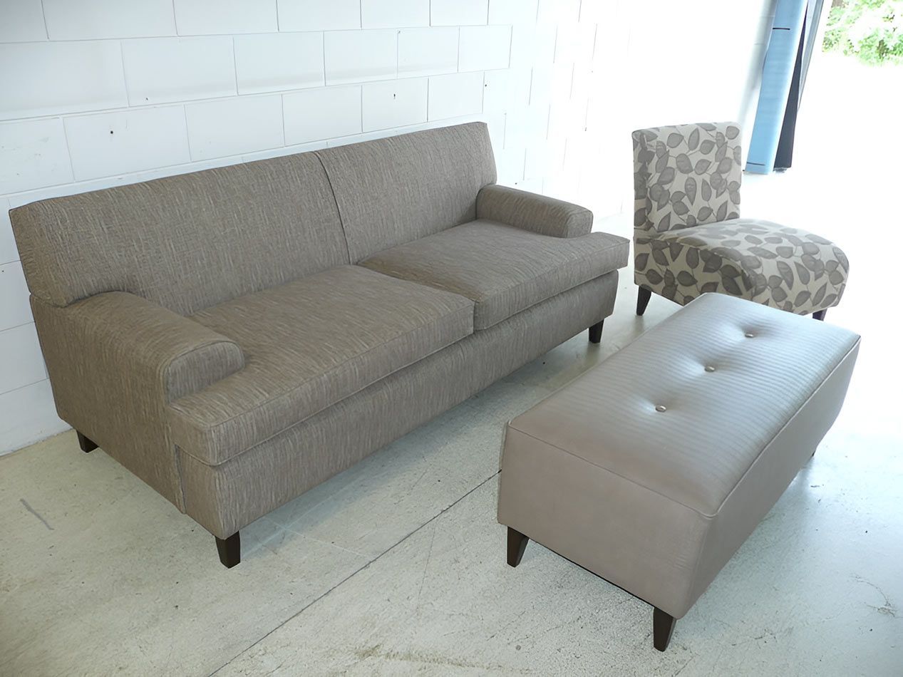 A Living Room With A Couch Ottoman And Chairs — Stitch Master in Manunda, QLD