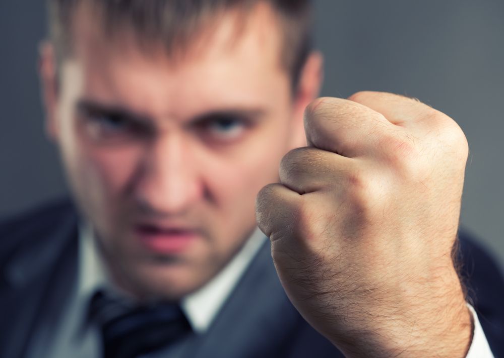 Angry man with clenched fist