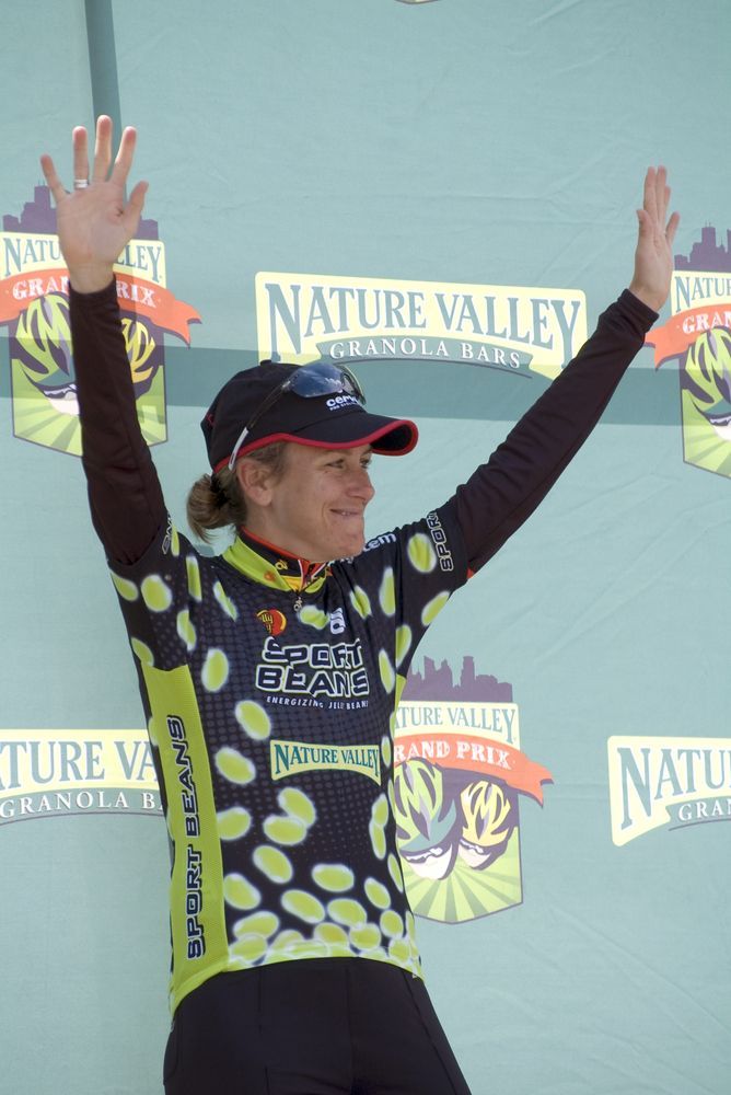 Pro American cyclist Kristin Armstrong celebrates atop the winners' podium after taking the polka dot jersey in the Nature Valley Grand Prix on June 14, 2009, in Stillwater, MN.