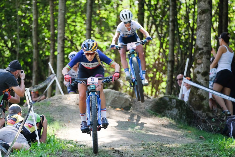 Pauline Ferrand-Prévot racing in the 2019 UCI Mountain Bike World Cup.
