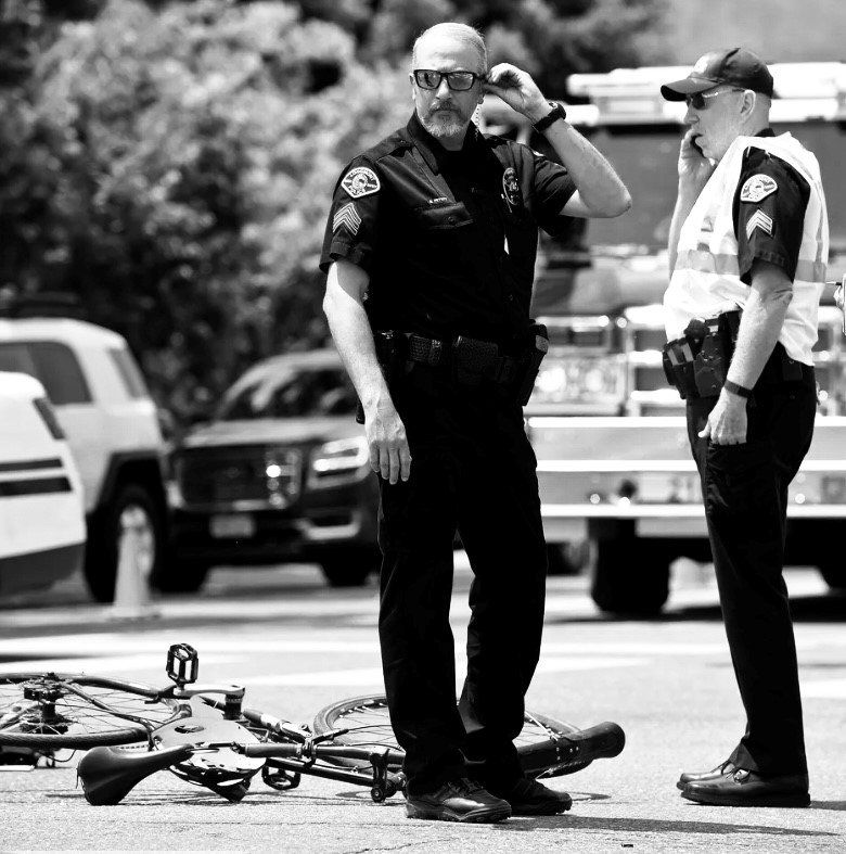 Two policeman responding to a vehicular accident