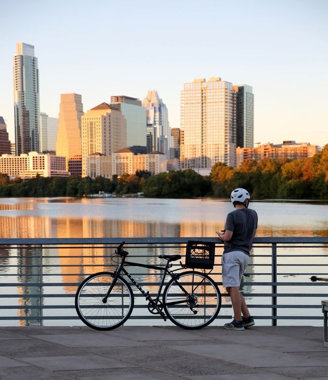 Bicyclist looking at the waterfront in San Antonio Texas