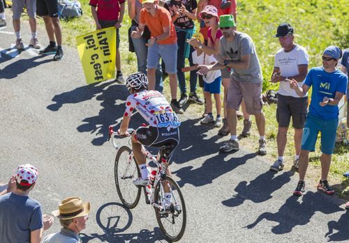 COL DU GRAND COLOMBIER,FRANCE-JUL 17: The Belgian cyclist Thomas De Gendt in Polka Dot Jersey riding on the road to Col du Grand Colombier in Jura Mountains during the stage 15 of Tour de France 2016