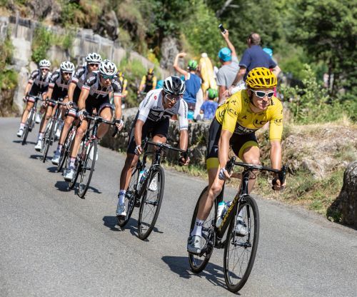  Pont-de-Montvert-Sud-Mont-Lozere, France - July 21, 2018: Egan Arley Bernal riding behind Geraint Thomas in Yellow Jersey on a descending road in Occitan region during the Tour de France 2018