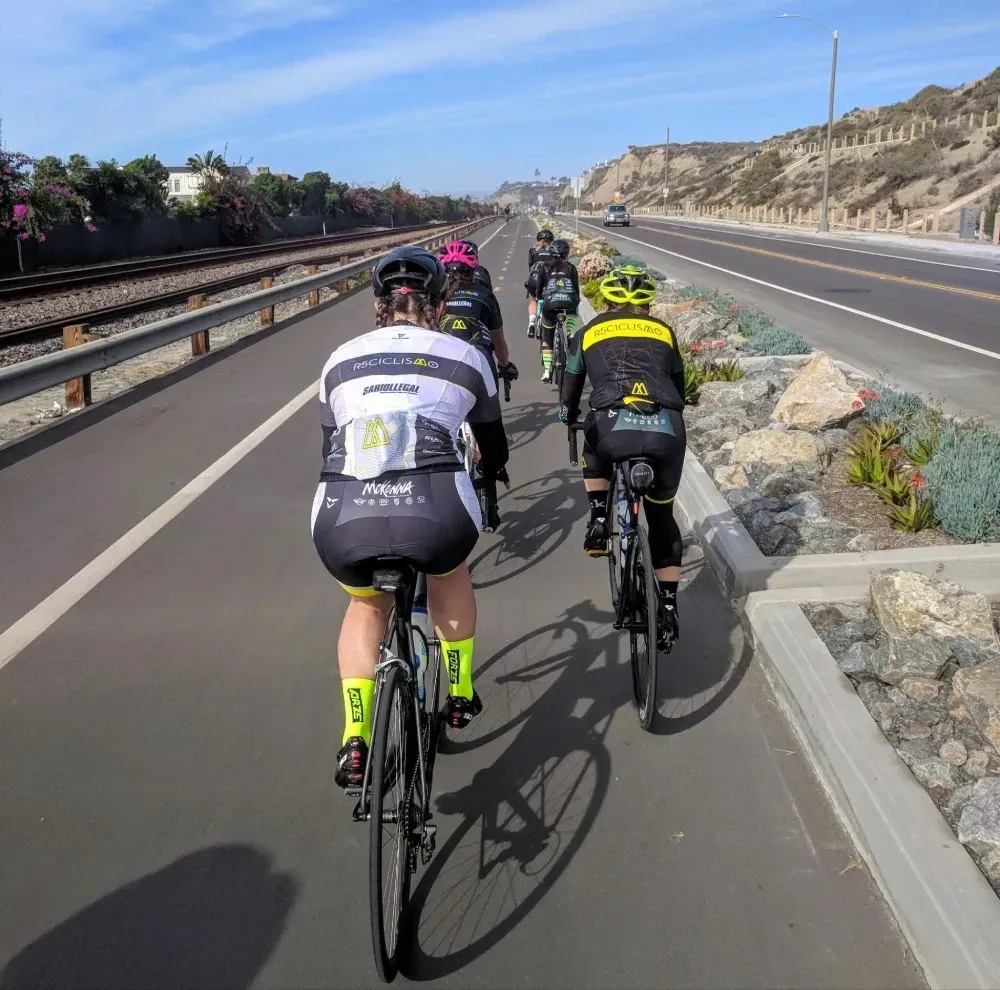 A group of cyclists riding along a Class 1 multi-use bike trail in San Clemente, California