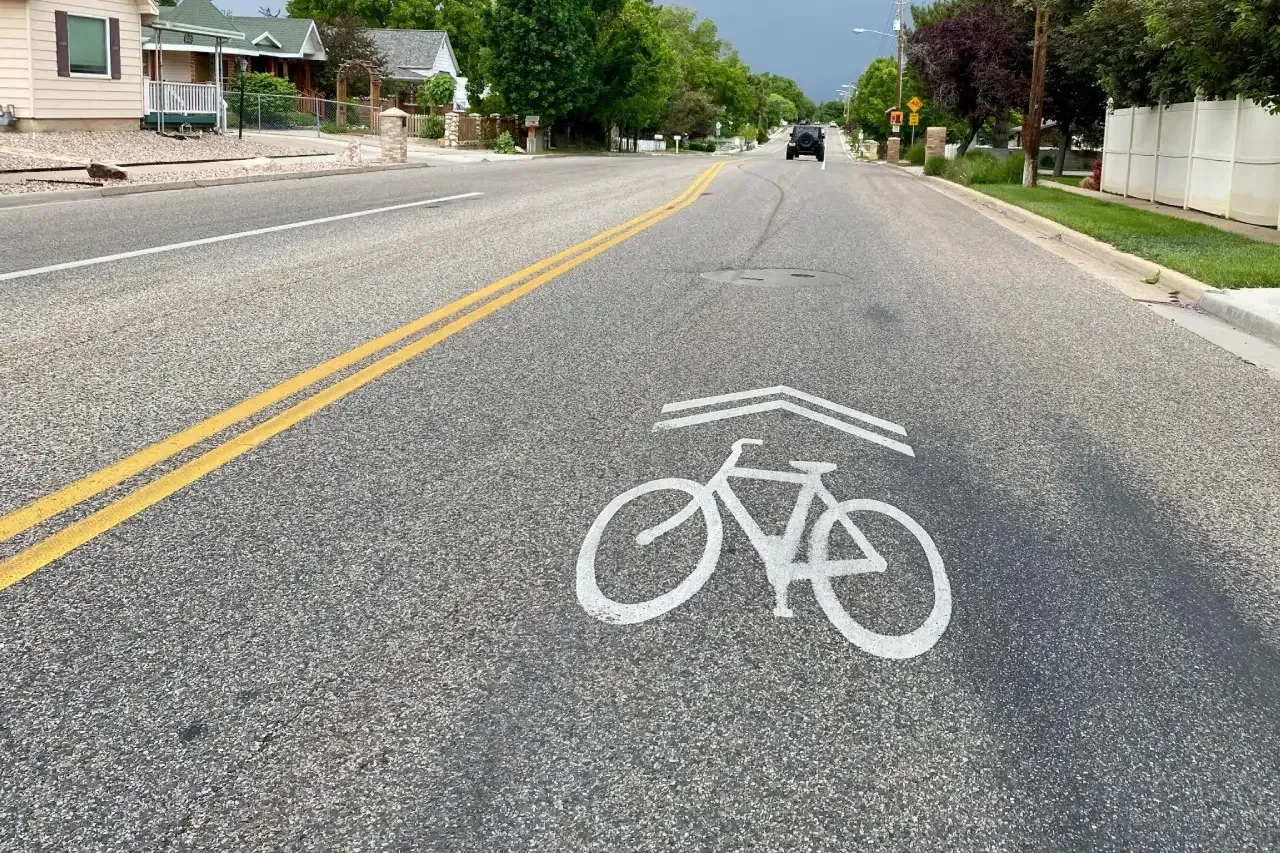 Painted bicycle symbols placed in the travel lane