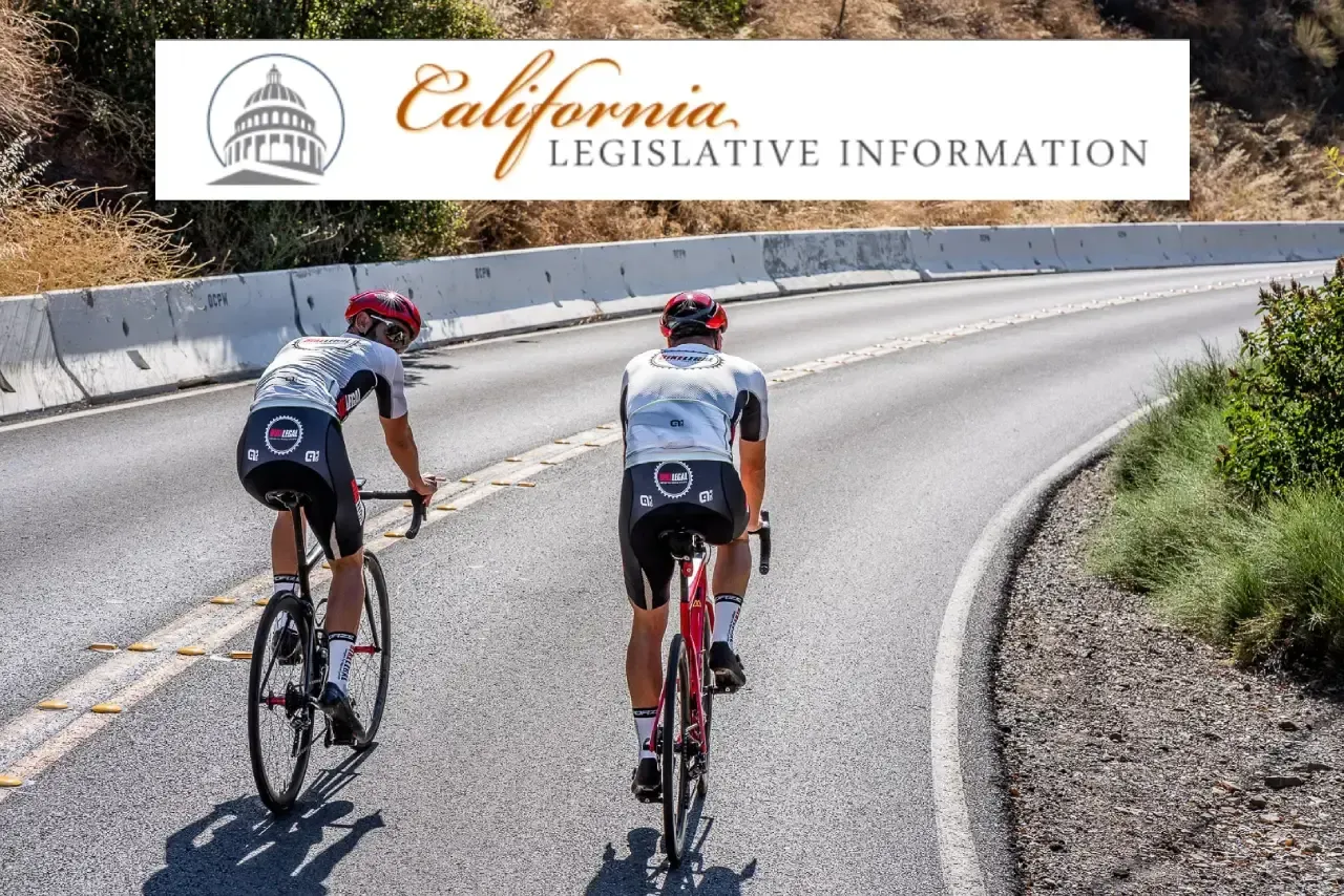 Two cyclists taking the lane and riding two abreast on narrow California road