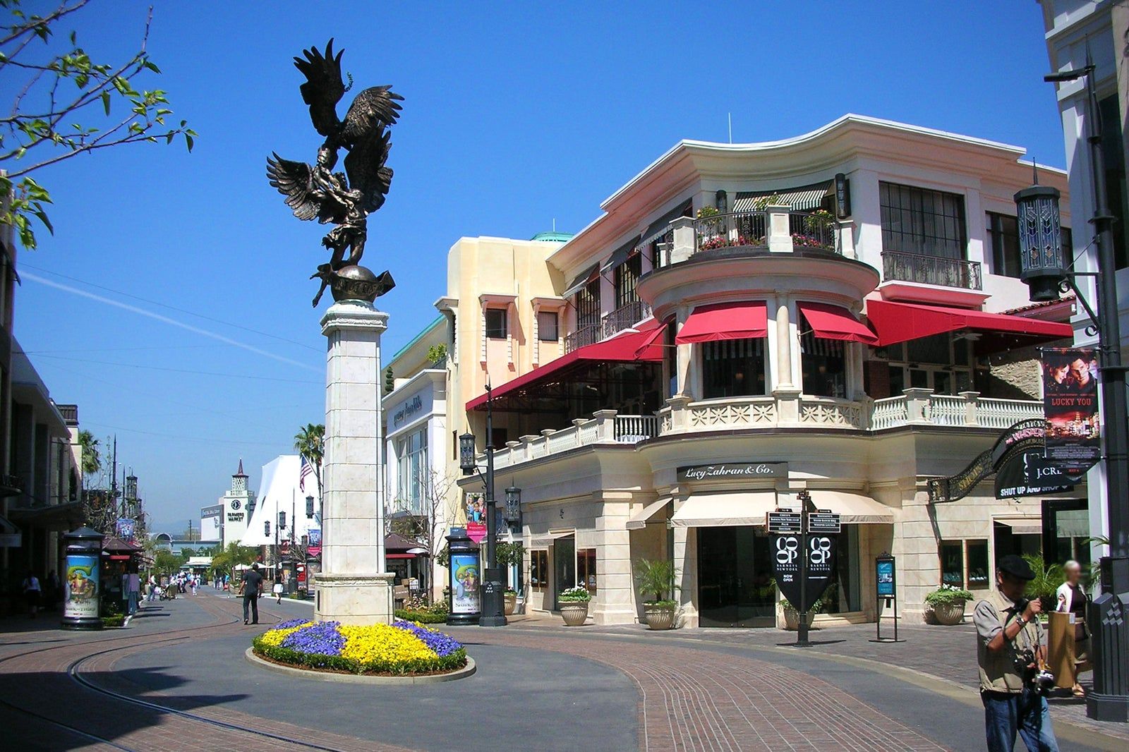 A statue of an eagle is in front of a building