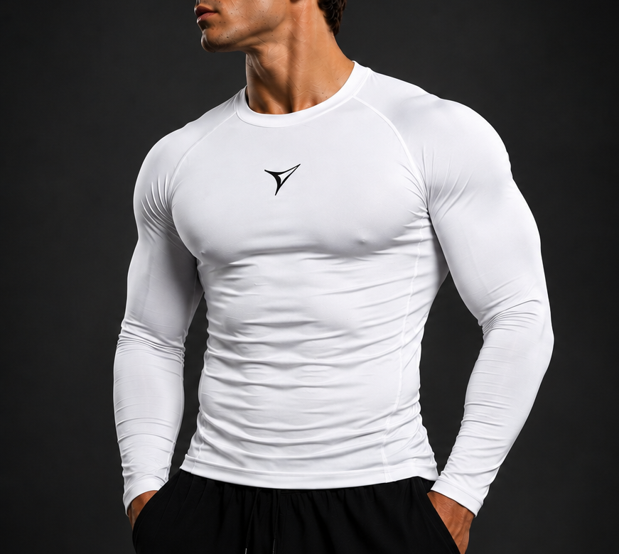 Man wearing a fitted white long-sleeve athletic shirt against a dark background