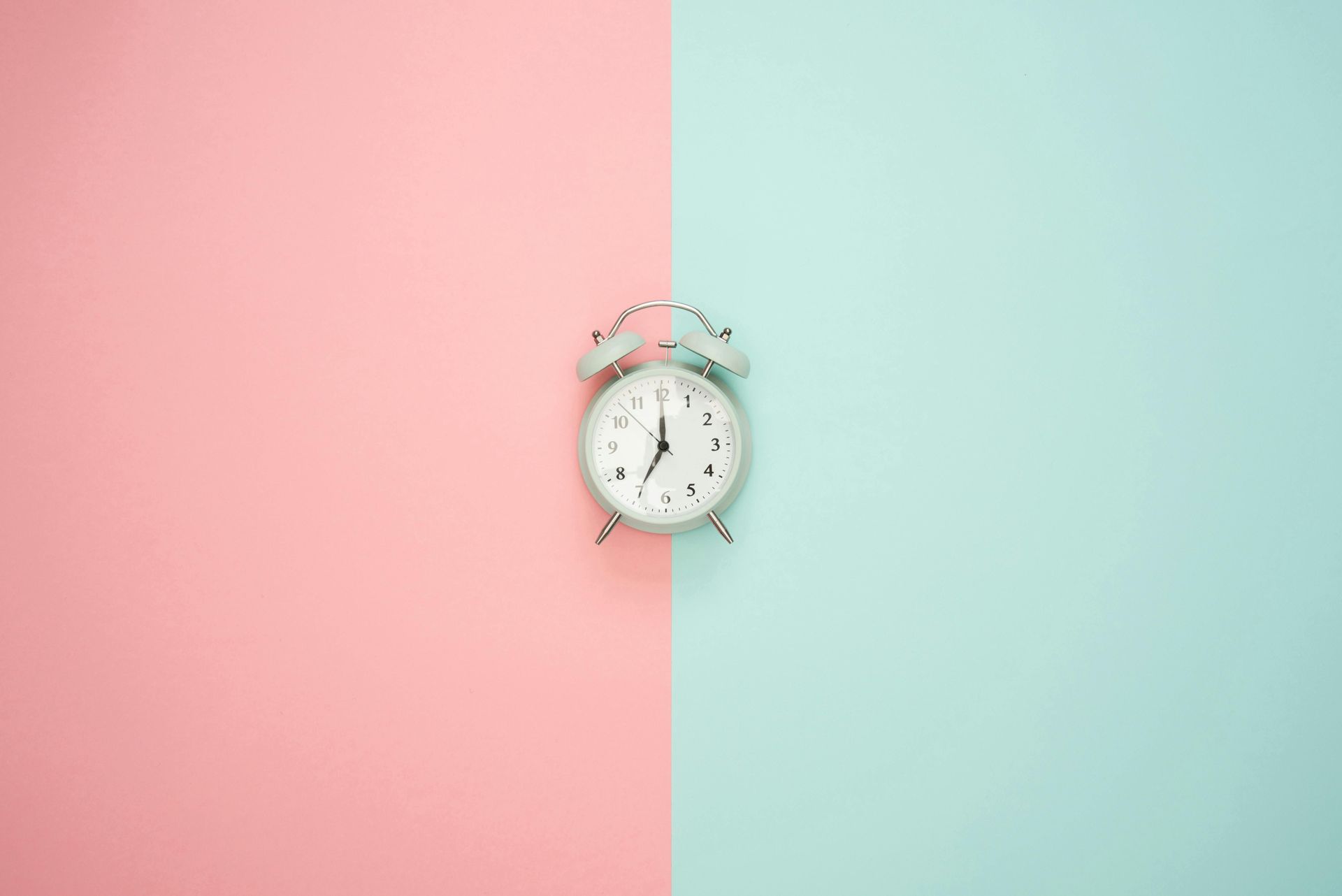 a clock on a double colored background