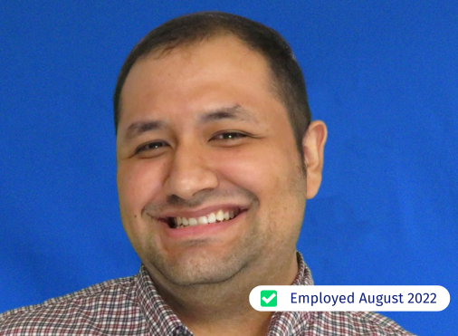 A man is smiling and has been employed since august 2022