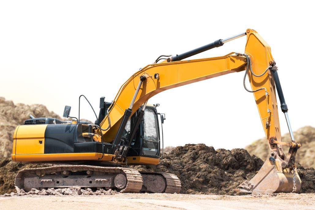 A yellow excavator is working on a construction site.