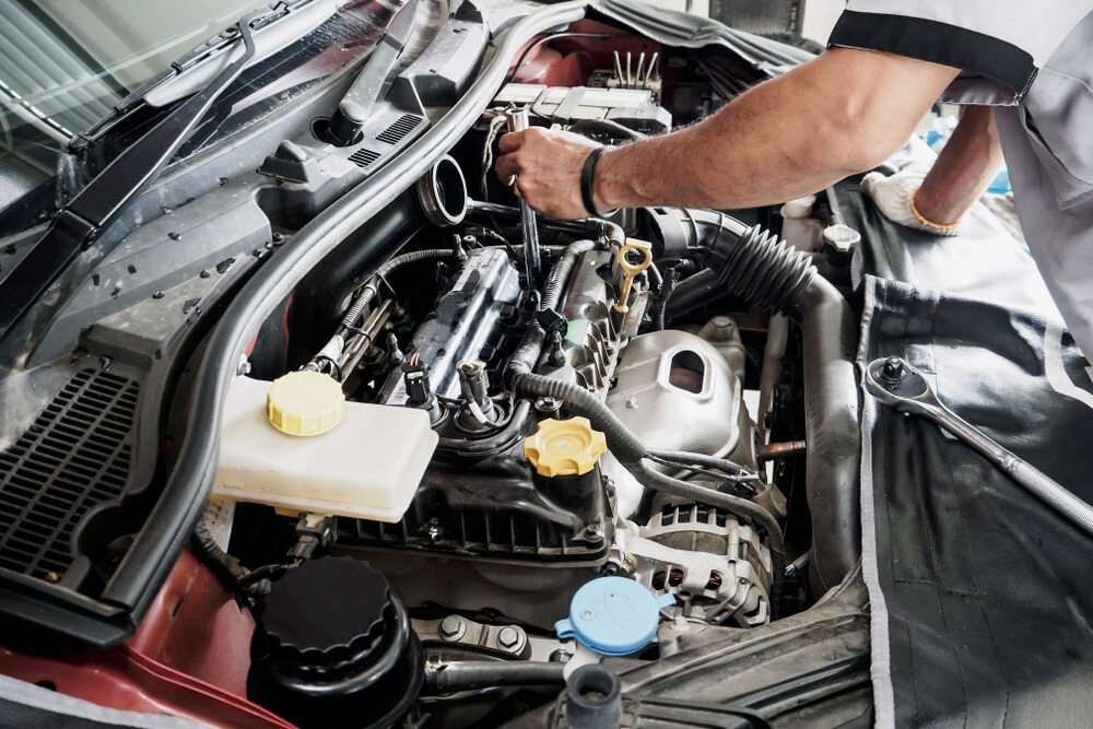 A Man is Working on the Engine of a Car — McCrackin Diesel in South Grafton, NSW