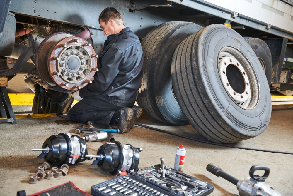 A Man is Working on a Truck in a Garage — McCrackin Diesel in South Grafton, NSW