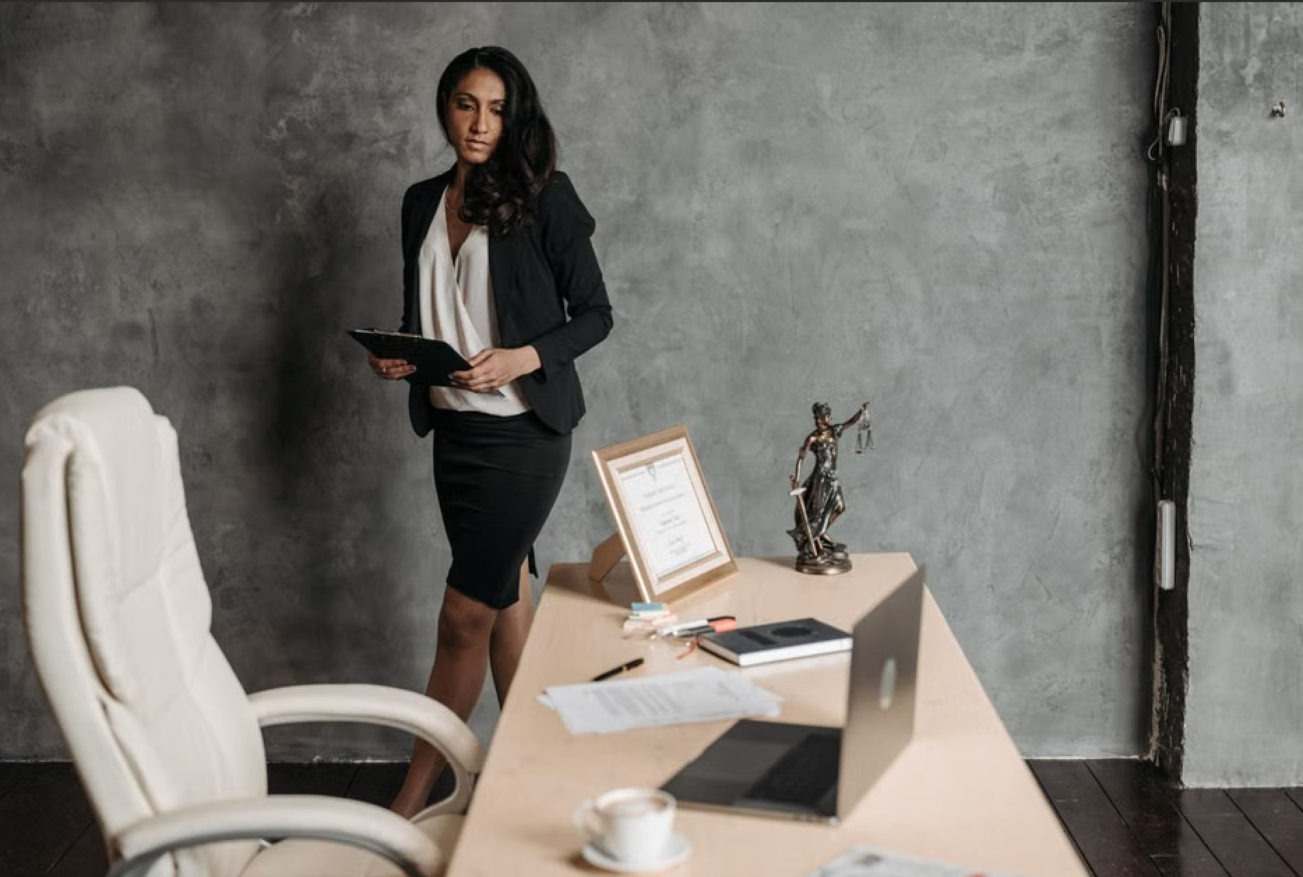 paralegal reviewing legal documents and drafting casework