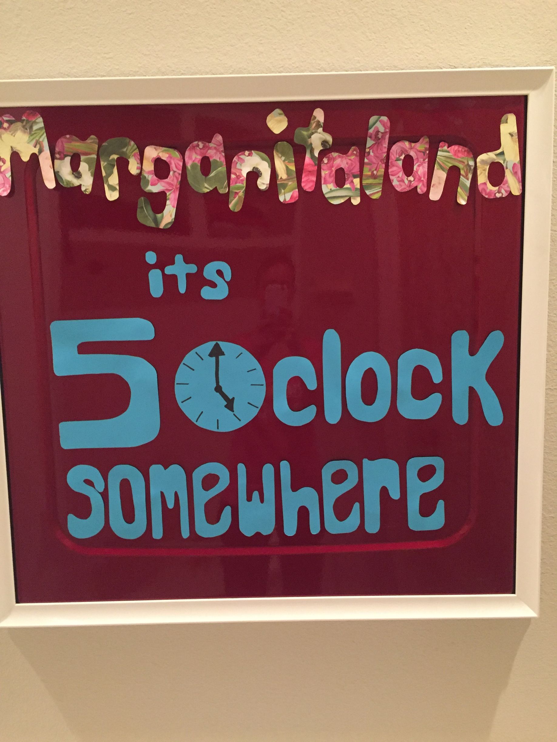 A sign that says margaritaland it 's 5 oclock somewhere