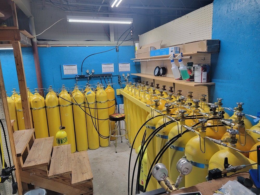 A store filled with lots of yellow gas cylinders.