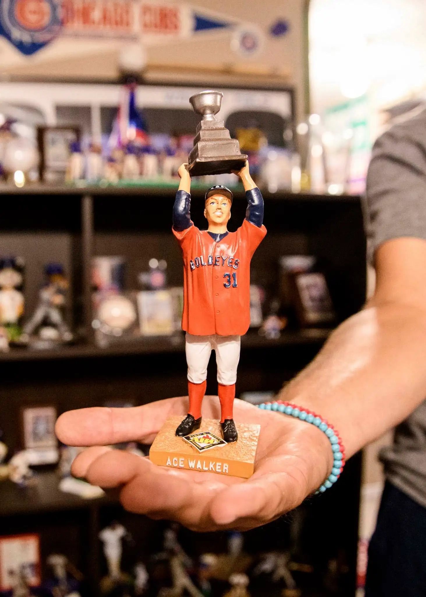 Ace Walker bobblhead displayed in someone's hand