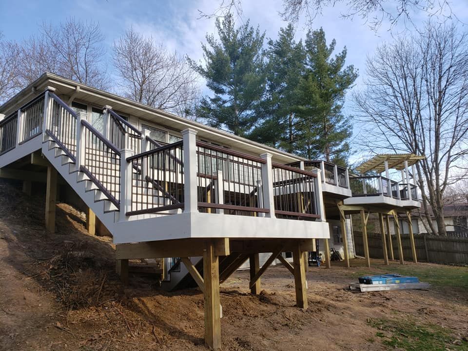 A house with a large deck and stairs leading up to it located in Urbana, IL.