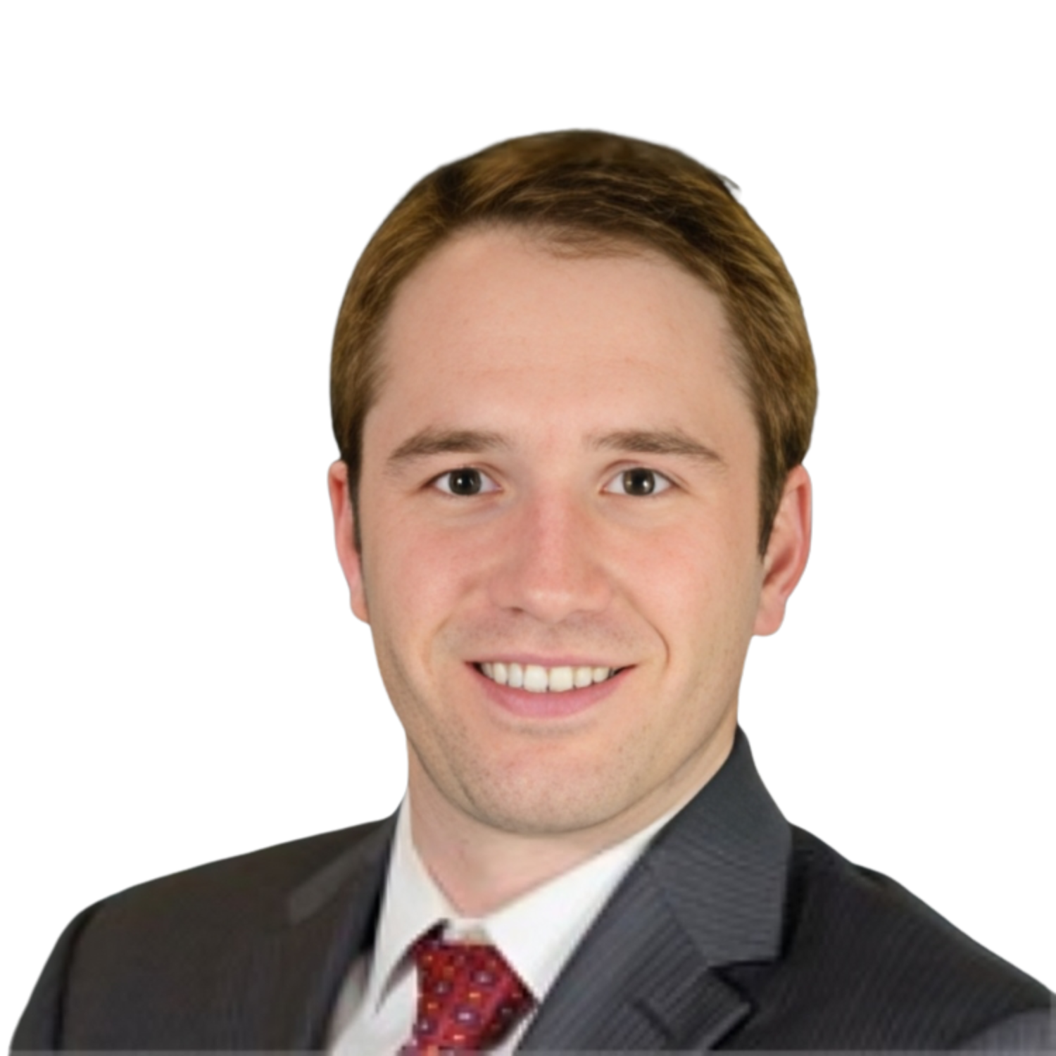 A man in a suit and tie smiles for the camera