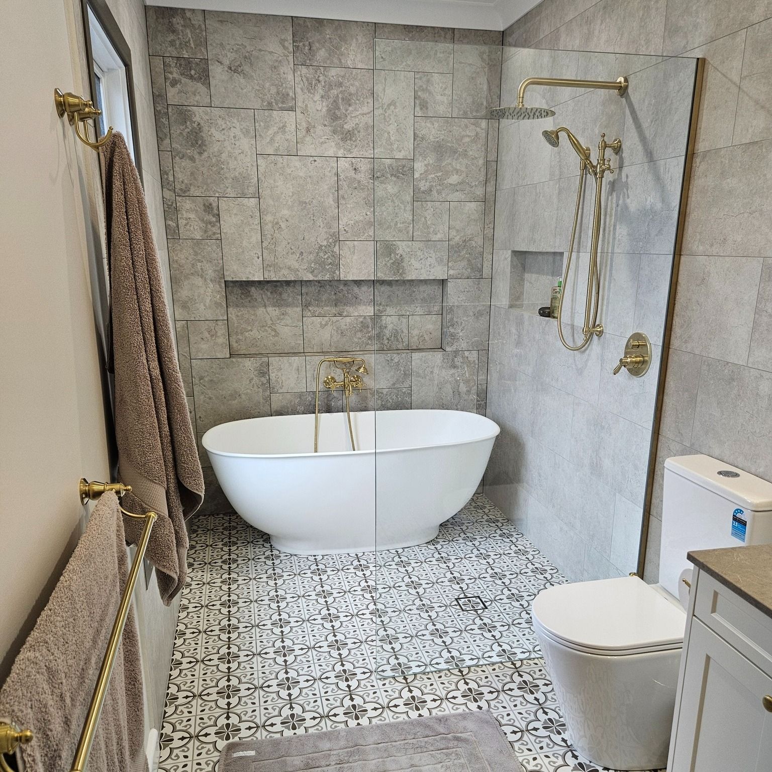 A Bathroom With A Bathtub Toilet And Shower – Melbourne, VIC - Deluxe Bathrooms & Tile Centre