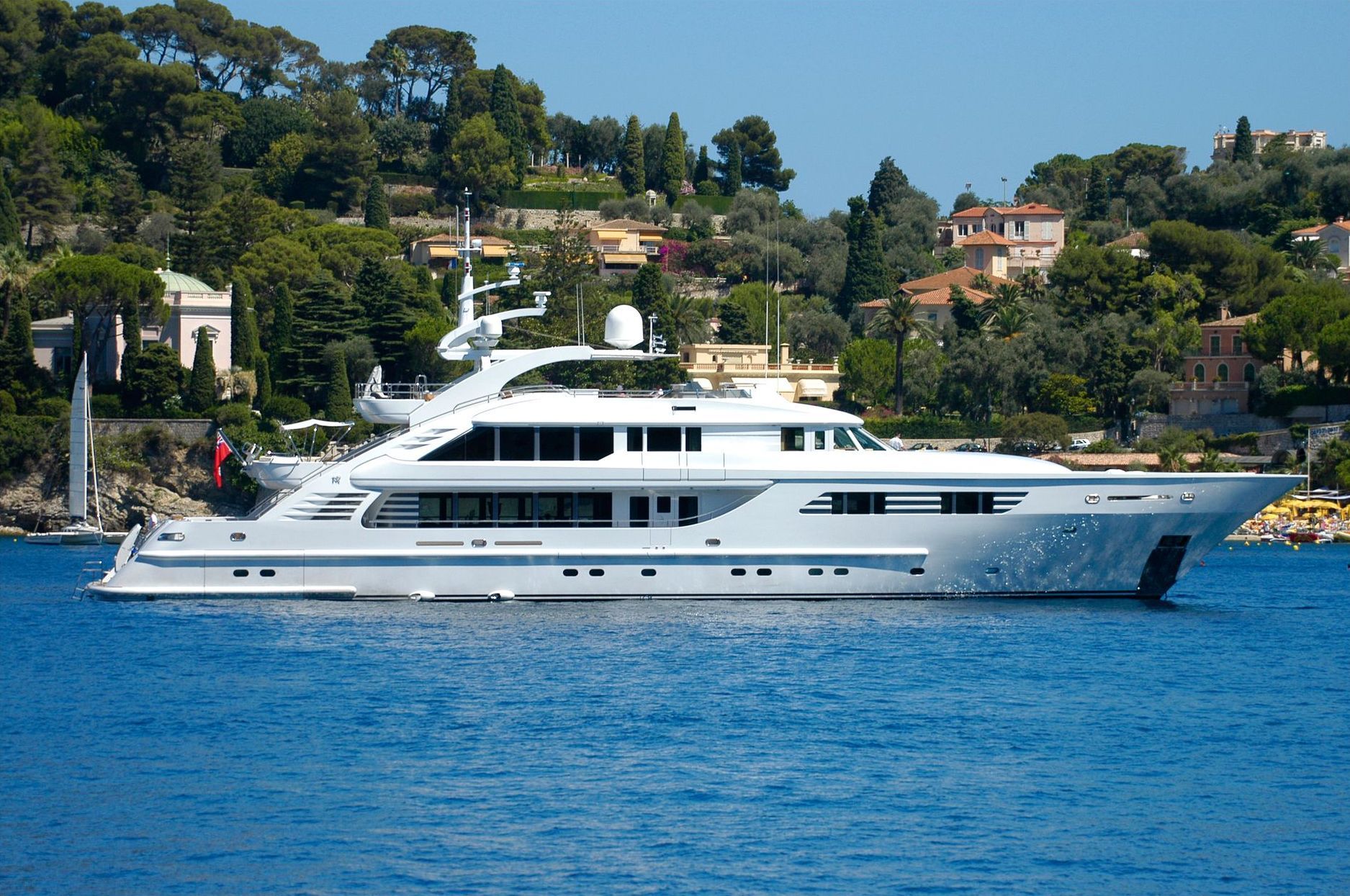 a large white superyacht is floating in calm seas at Villefranche, France