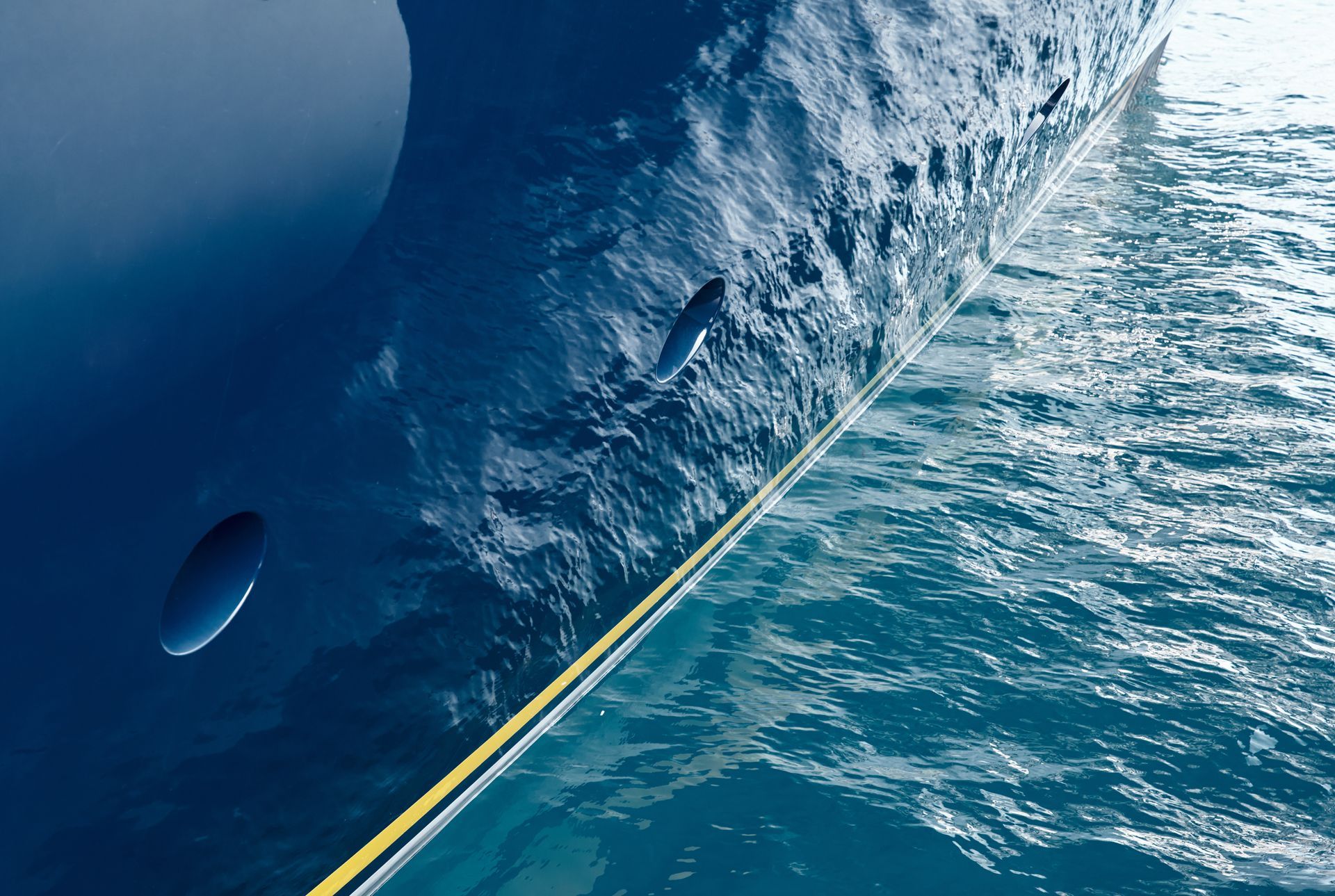 Superyacht in turquoise calm sea with reflections on blue hull