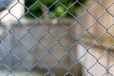 Chain Link Fence with A Blurry Background | Cranbourne, VIC | Cranbourne Fencing Pty Ltd