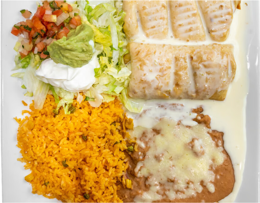 A white plate topped with a burrito , rice , beans and salsa.