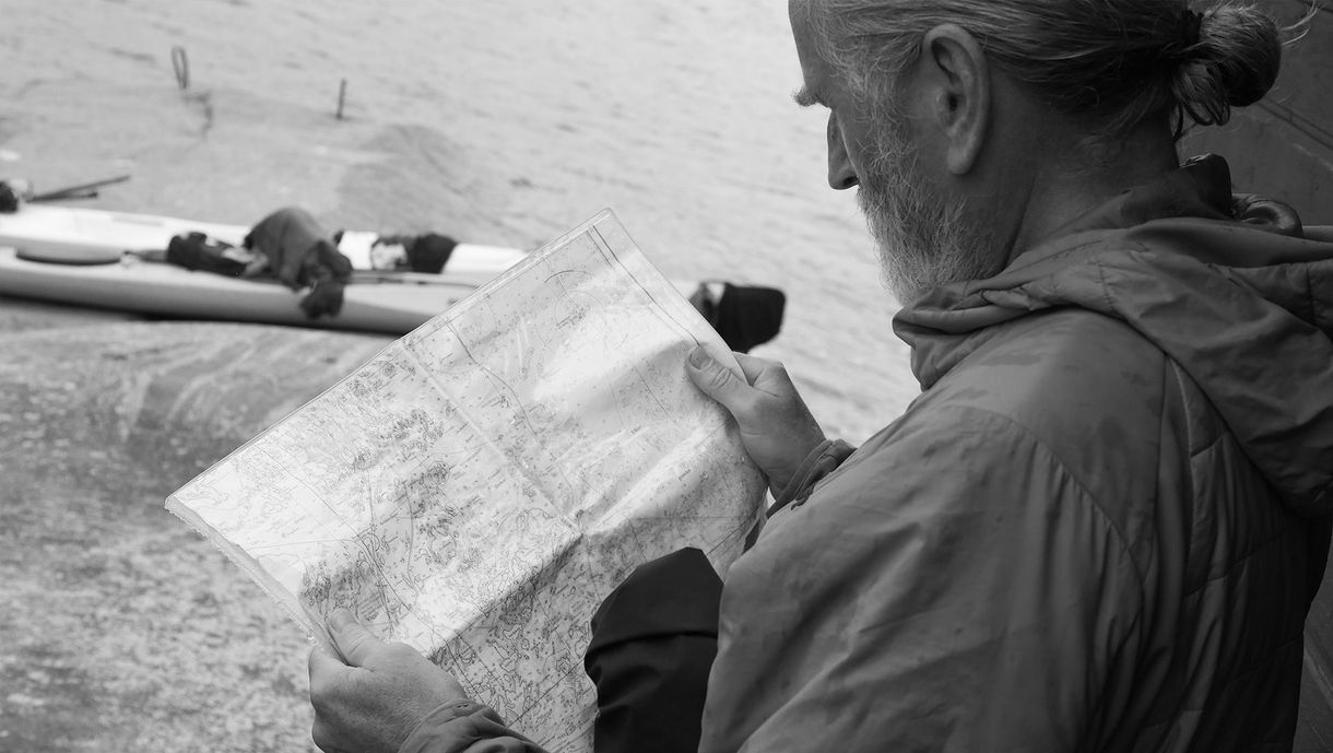 Erik checking the map during a kayak trip in Gryt Archipelago, Sweden