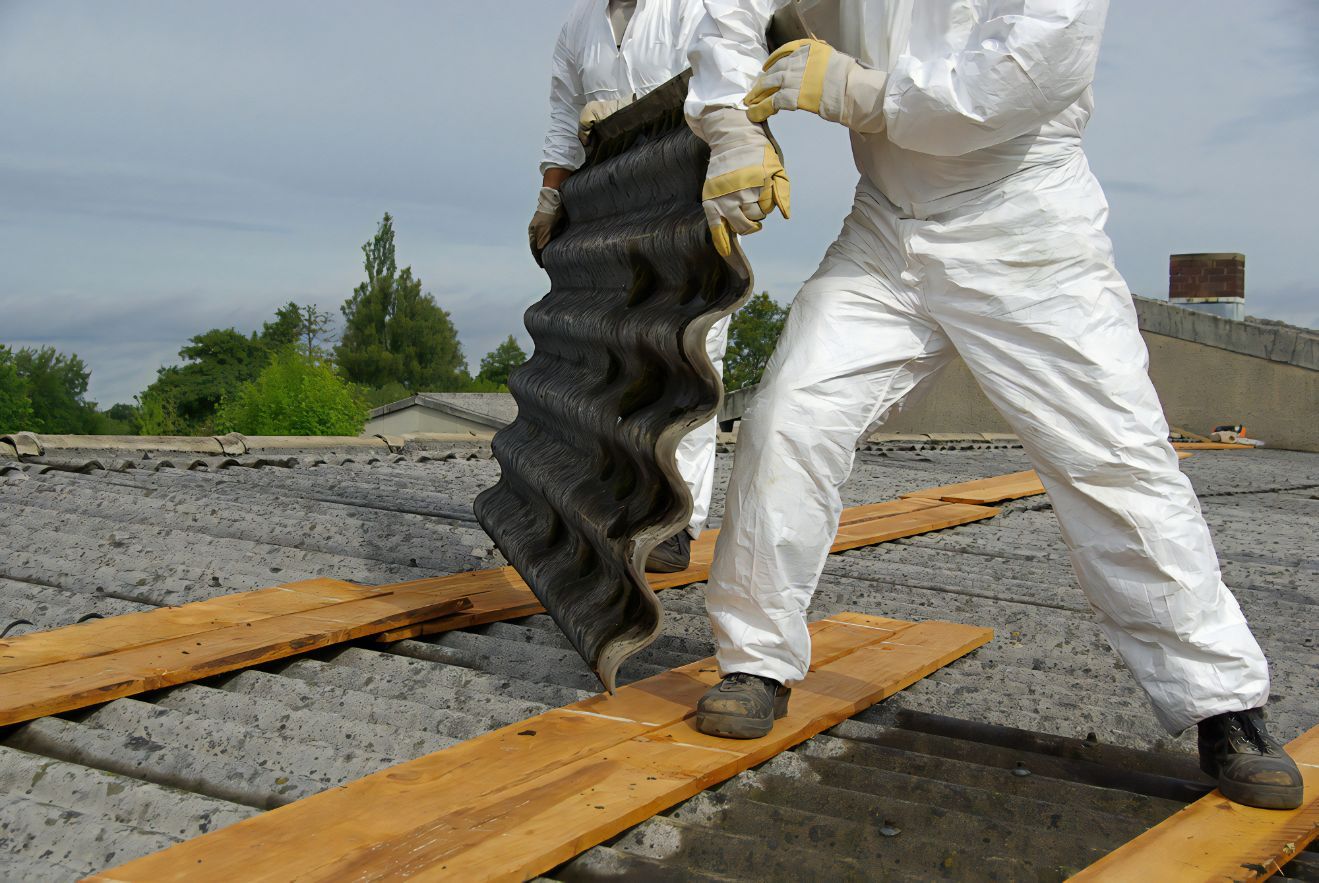 Two Men in White Suits Holding a Piece of Asbestos — Stormguard Roofing In Caloundra West, QLD