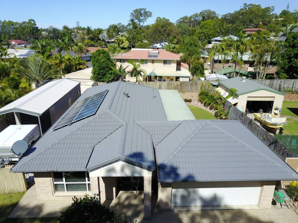 An Aerial View of a House With a Gray Roof — Stormguard Roofing In Caloundra West, QLD