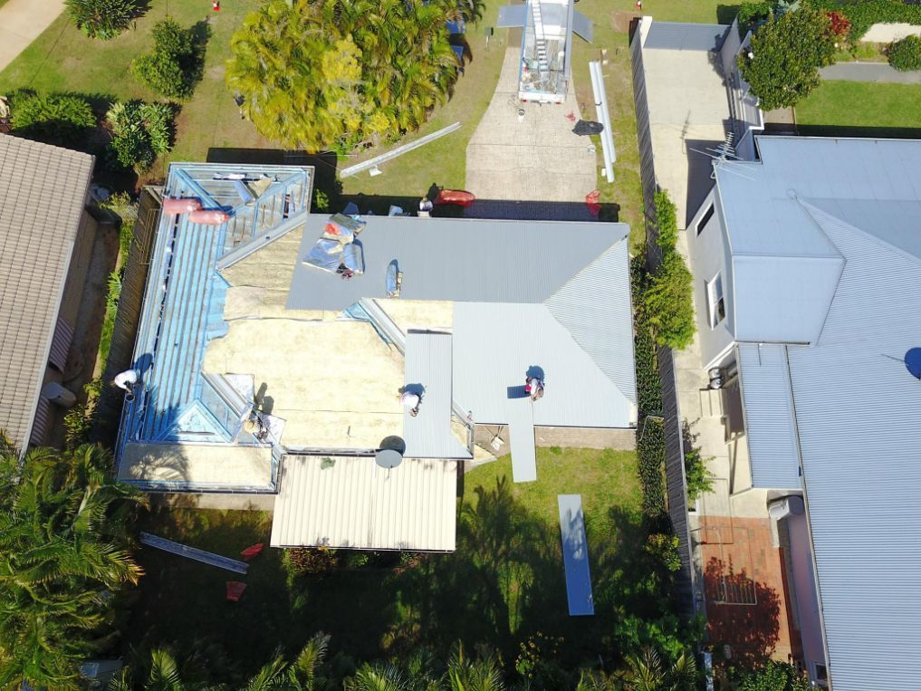 An Aerial View of a House That is Being Remodeled — Stormguard Roofing In Caloundra West, QLD