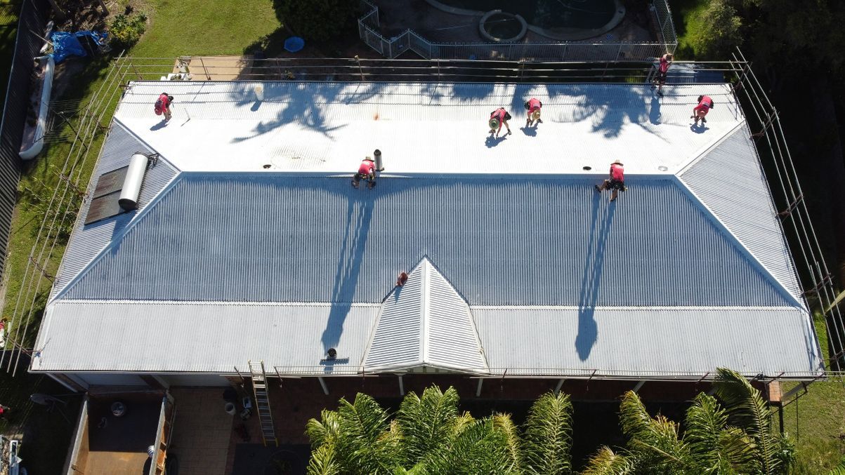 An Aerial View of a House With a Roof Being Installed — Stormguard Roofing In  North Lakes, QLD