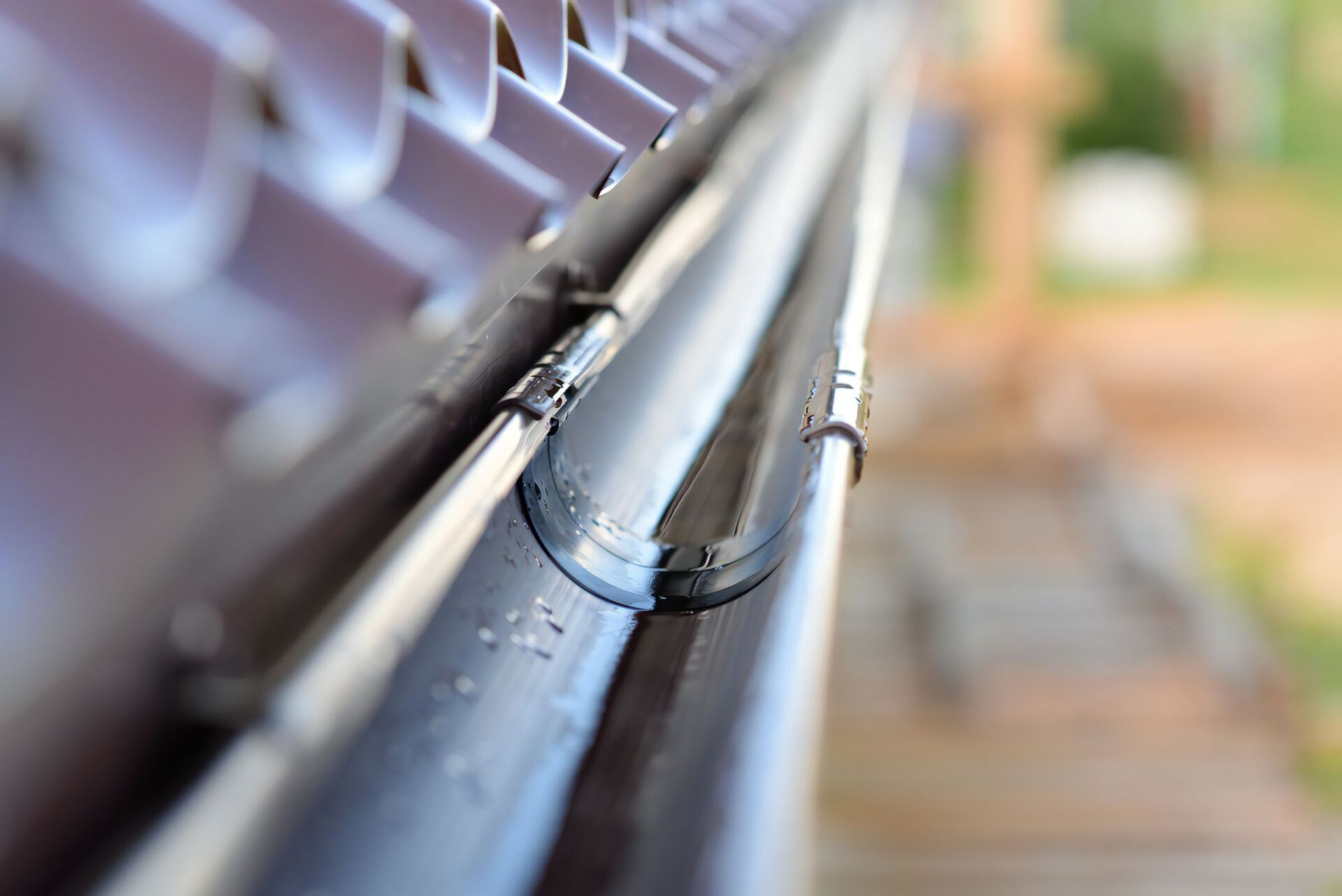 A Close Up of a Gutter on a Roof — Stormguard Roofing In Caloundra West, QLD