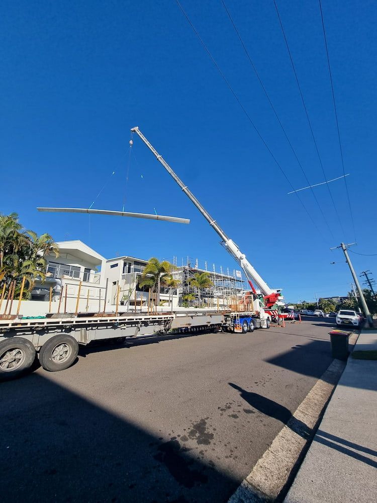 A Large Crane is Sitting on Top of a Truck — Stormguard Roofing In Caloundra, QLD