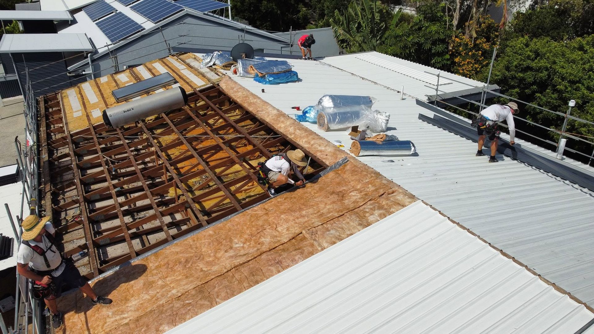 Roofing Crew Repairing a Damaged Roof — Stormguard Roofing In Brisbane, QLD