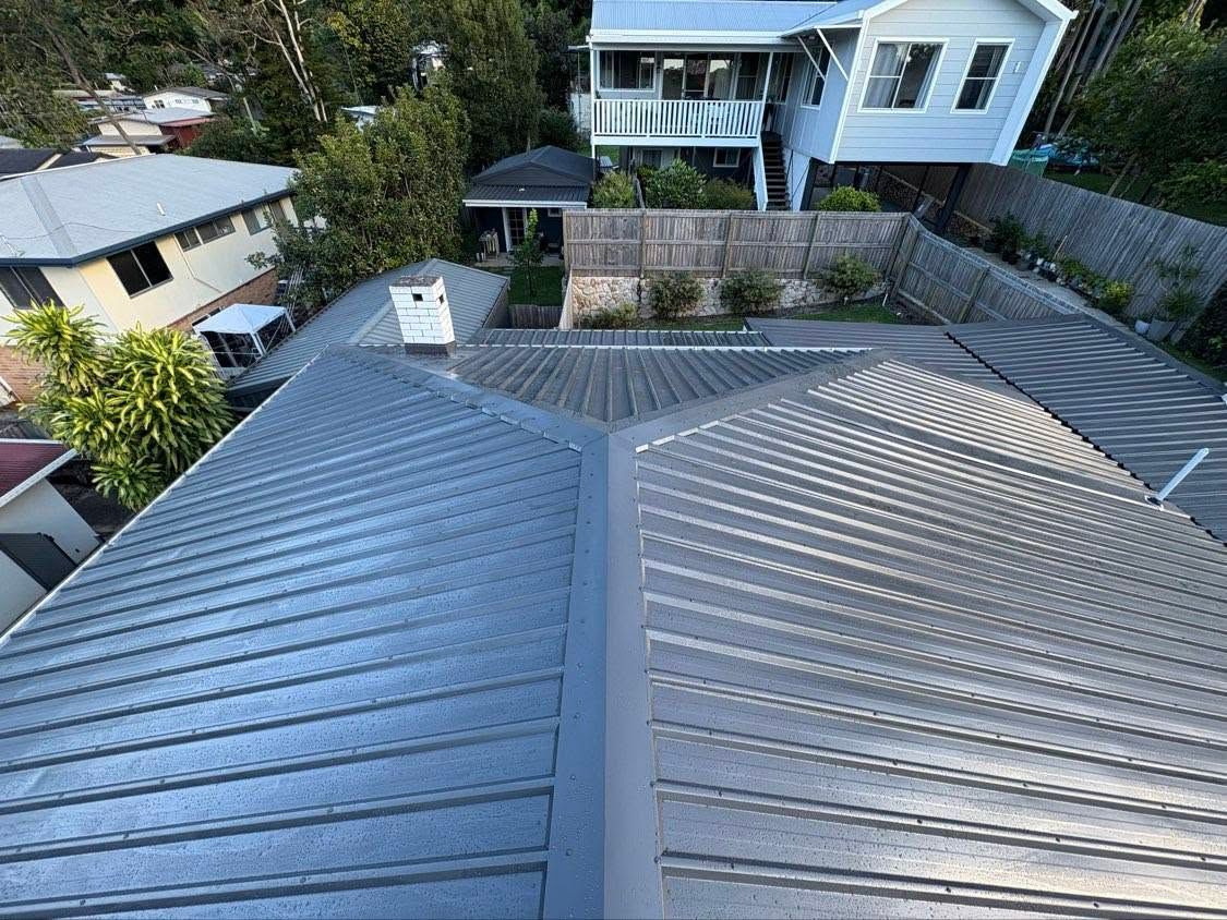 Rooftop Metal Roofs With a Central Ridge — Stormguard Roofing In Caloundra West, QLD