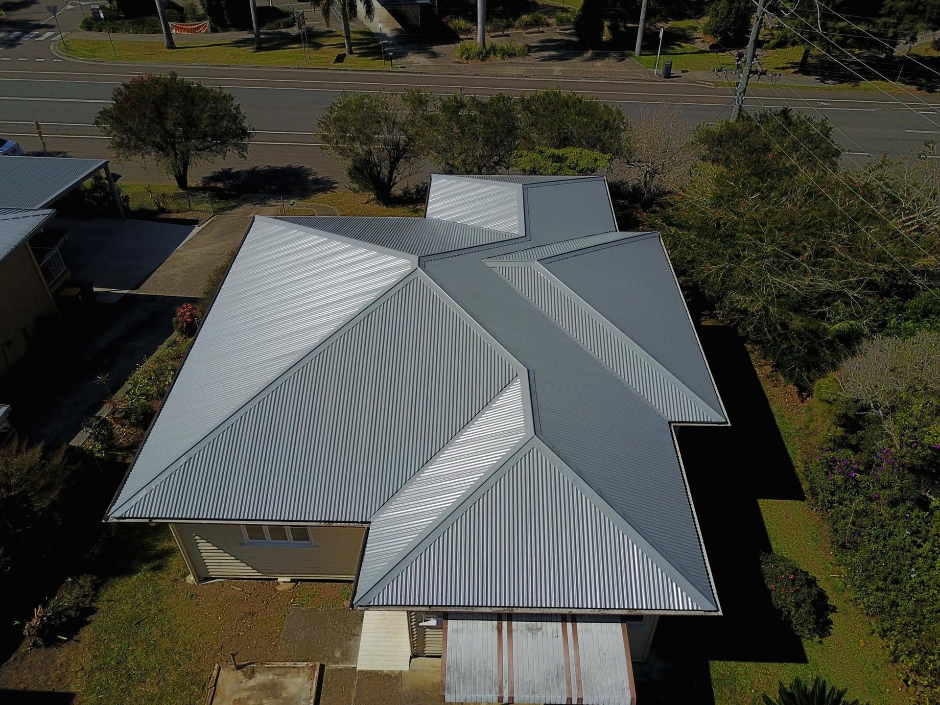 Aerial View of a House With a Silver Metal Roof — Stormguard Roofing In North Lakes, QLD