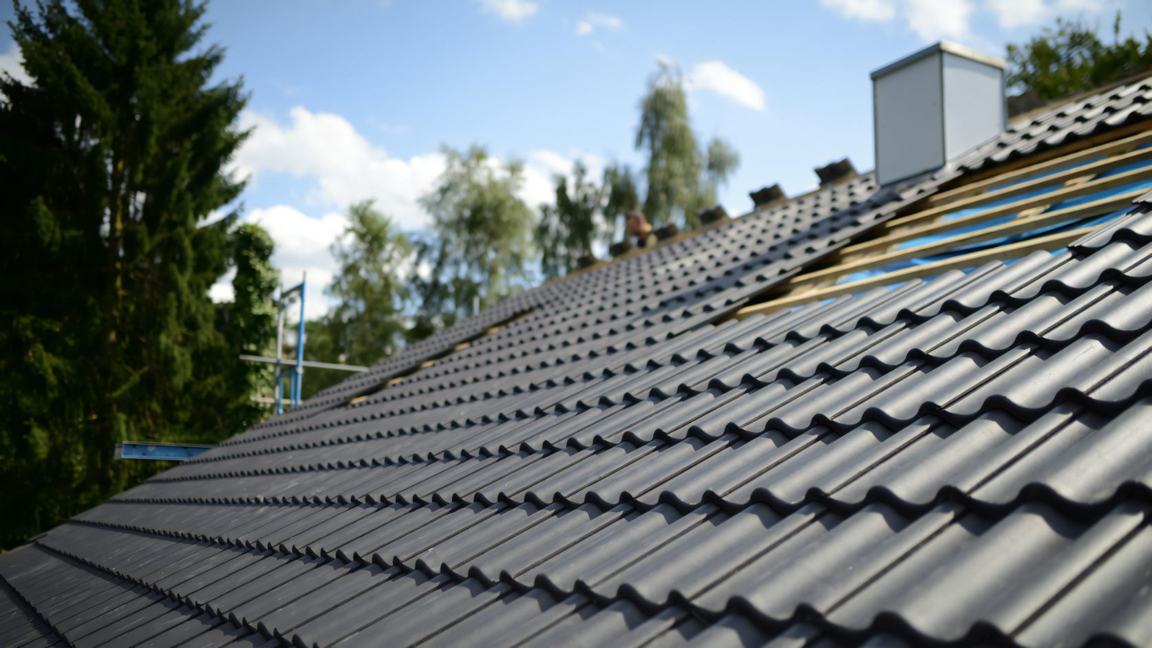 A Roof With a Lot of Tiles on It is Being Built — Stormguard Roofing In Caloundra West, QLD