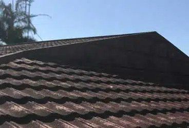 A Close Up of a Tiled Roof With a Blue Sky in the Background — Stormguard Roofing In Caloundra West, QLD