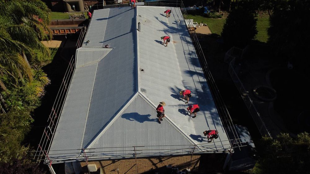 Roofers on Top of A Residential Home
