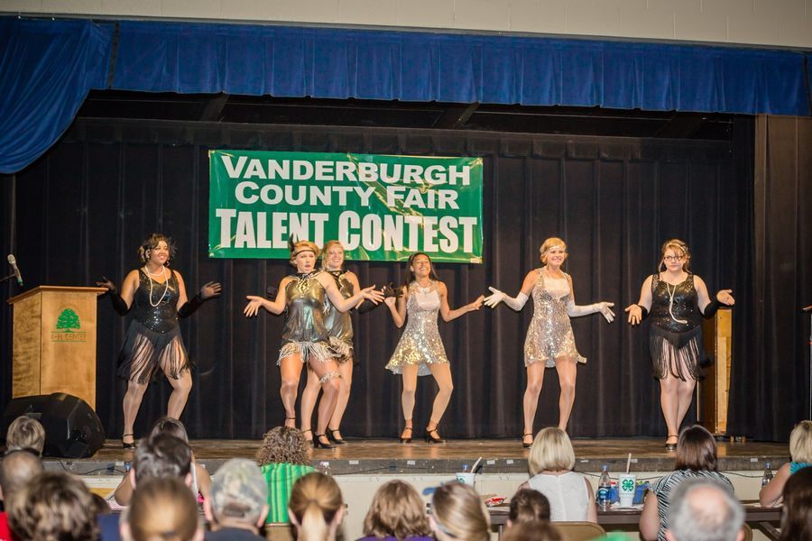 Dance performers onstage at the Vanderburgh County Fair Talent Contest, with audience in front